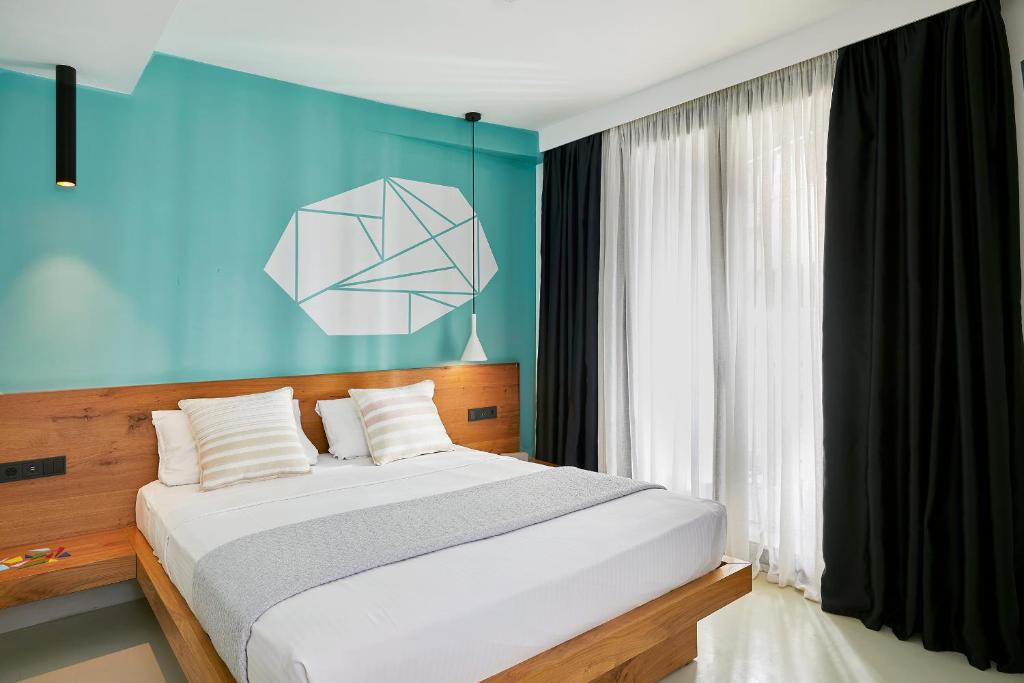 Letto o letti in una camera di Mosaikon