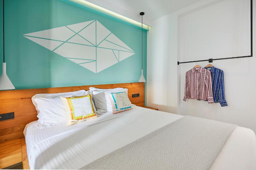 Letto o letti in una camera di Mosaikon