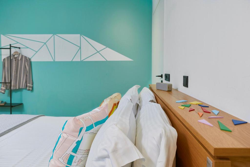 Letto o letti in una camera di Mosaikon