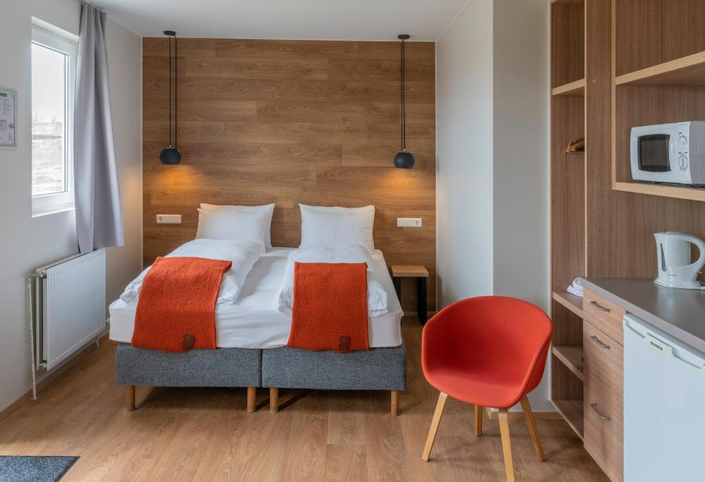 Rúm í herbergi á Stracta Hotel
