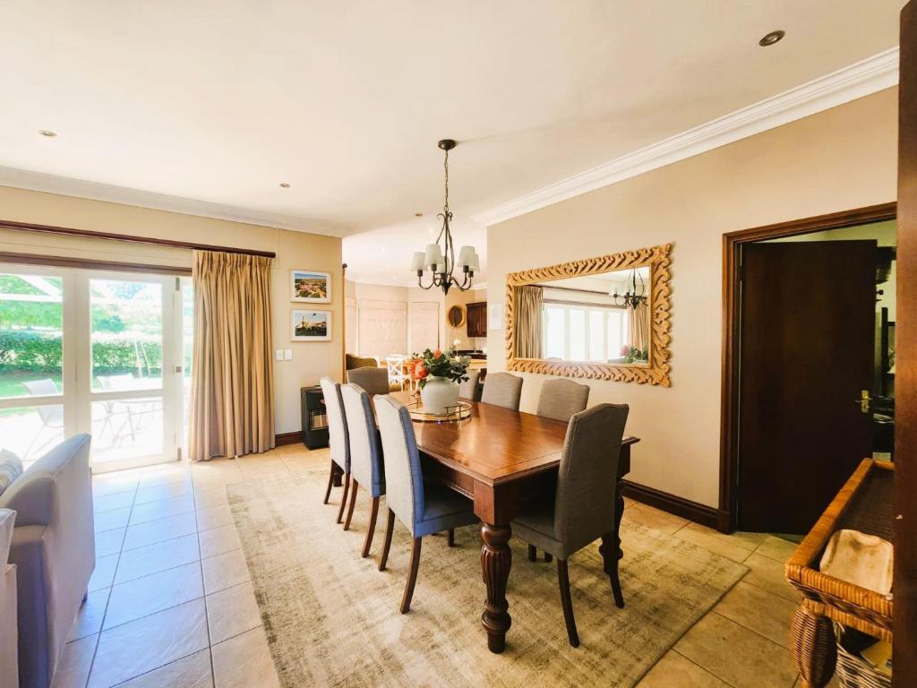 a dining room with a table and chairs at Main Home 4 Rawdons Estate in Nottingham Road