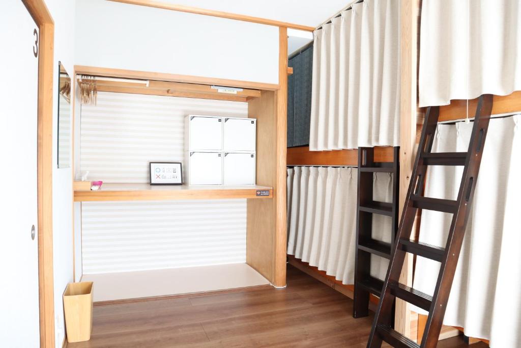 Postel nebo postele na pokoji v ubytování Ise Guest House Sora