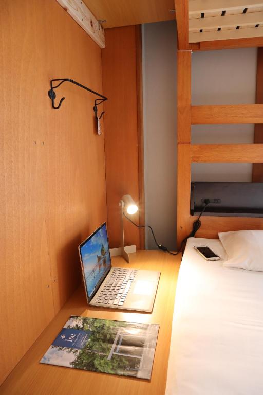 Postel nebo postele na pokoji v ubytování Ise Guest House Sora