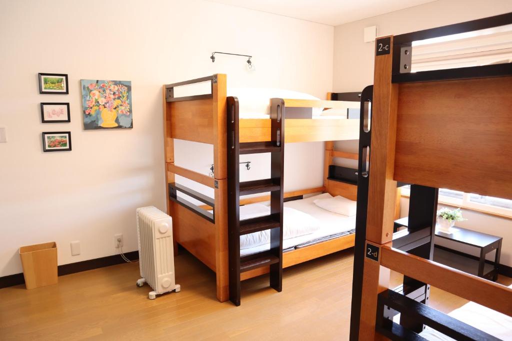 Postel nebo postele na pokoji v ubytování Ise Guest House Sora