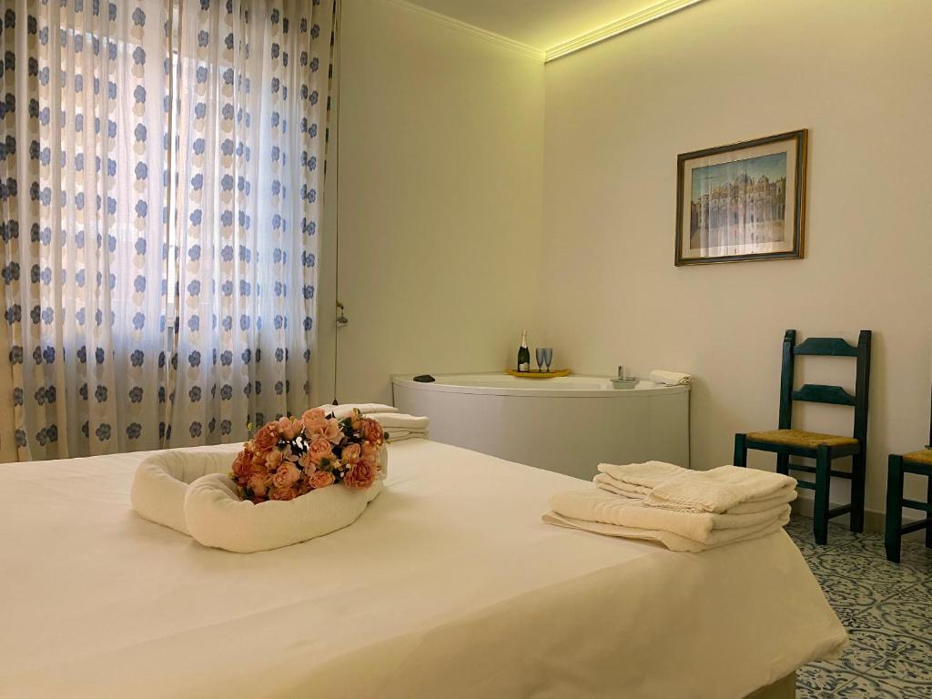Postel nebo postele na pokoji v ubytování Suite della villa