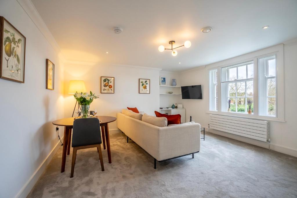 a living room with a couch and a table at Apartment 8 - Bootham House in York