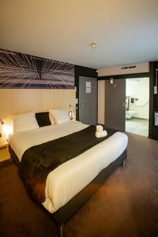 Postel nebo postele na pokoji v ubytování Hotel & Aparthotel Alize Mouscron
