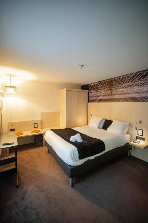 Postel nebo postele na pokoji v ubytování Hotel & Aparthotel Alize Mouscron