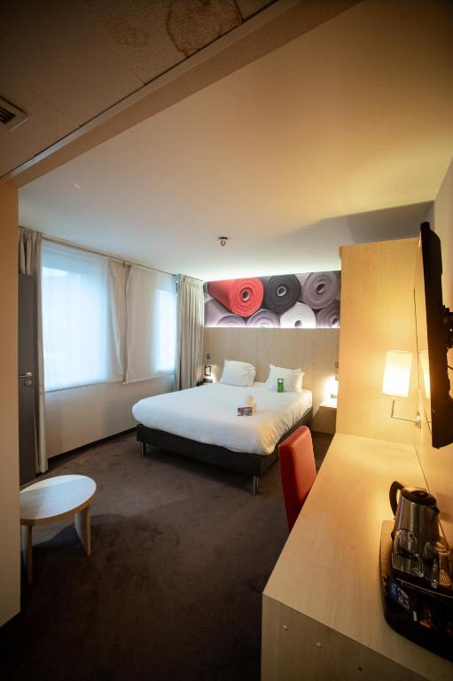 Postel nebo postele na pokoji v ubytování Hotel & Aparthotel Alize Mouscron