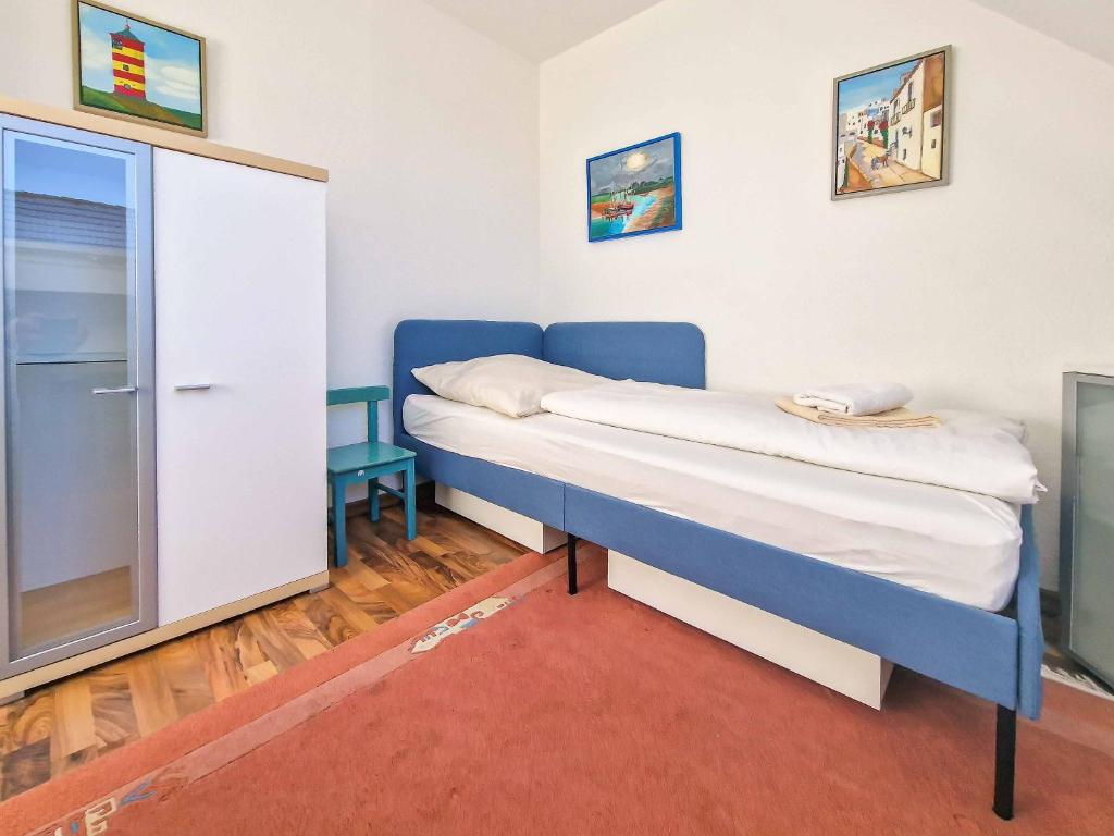 Postel nebo postele na pokoji v ubytování Sonnenhus