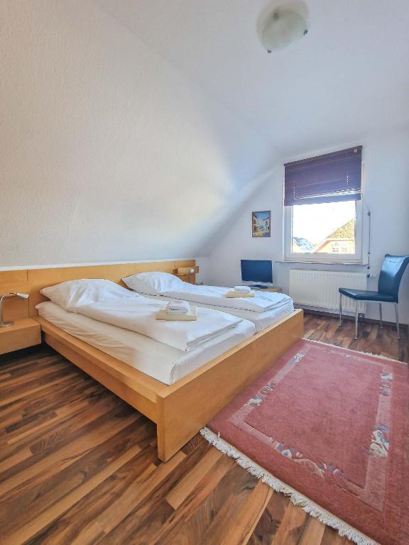 Postel nebo postele na pokoji v ubytování Sonnenhus