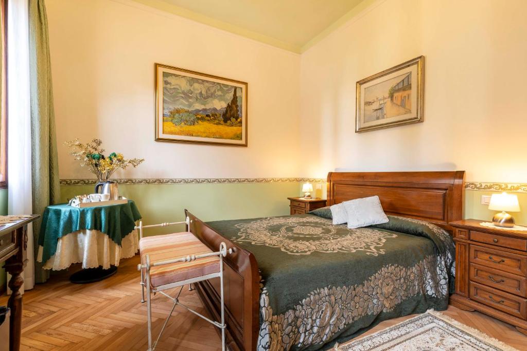 Postel nebo postele na pokoji v ubytování Bed and Breakfast Casa delle Rose Lido Venezia