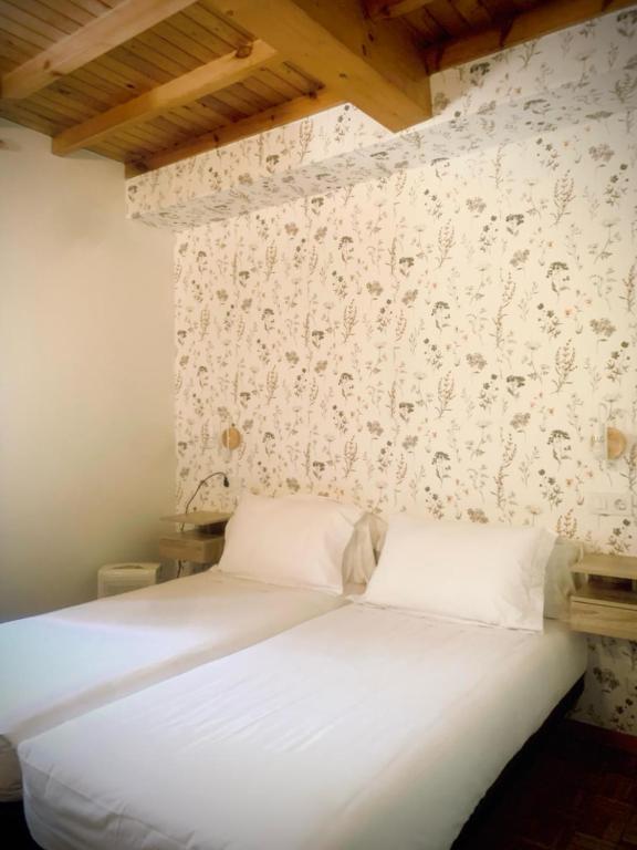 Postel nebo postele na pokoji v ubytování Hostal As Margaritas