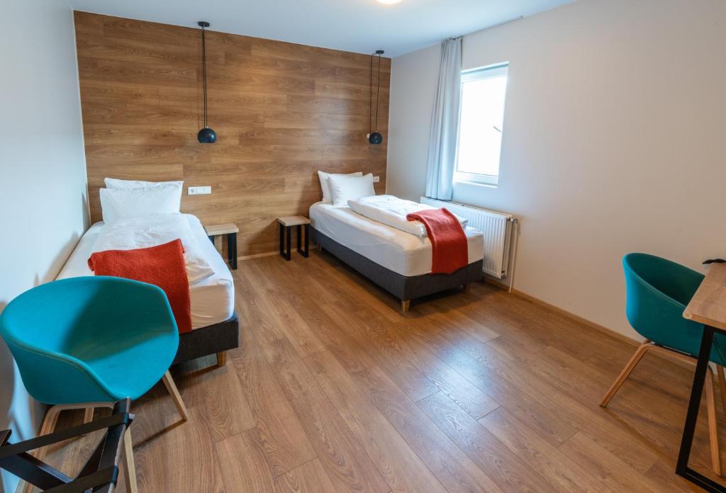 Rúm í herbergi á Stracta Hotel