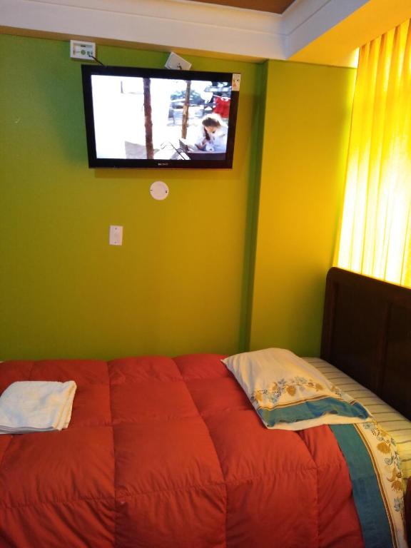 Postel nebo postele na pokoji v ubytování HOSTAL JOYA ANDINA