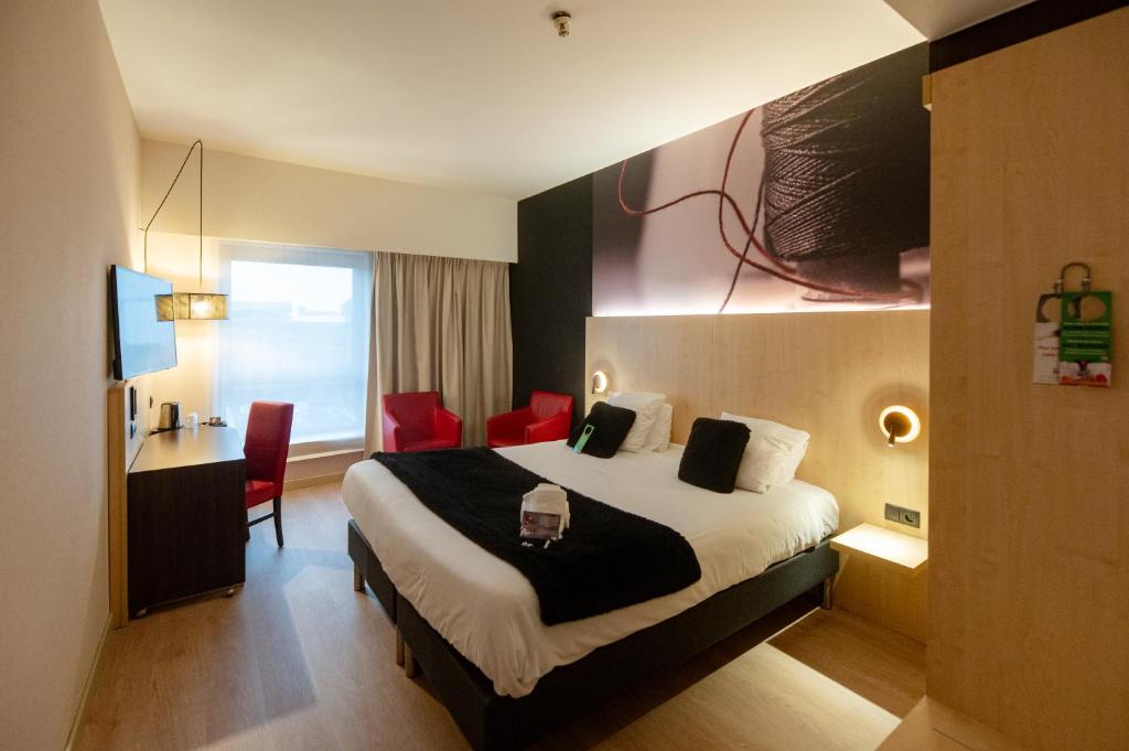 Postel nebo postele na pokoji v ubytování Hotel & Aparthotel Alize Mouscron