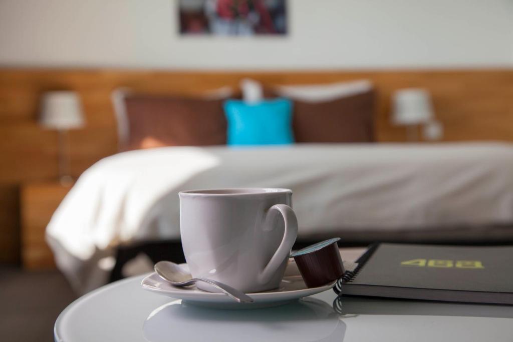 Postel nebo postele na pokoji v ubytování Apart'Hotel 46a