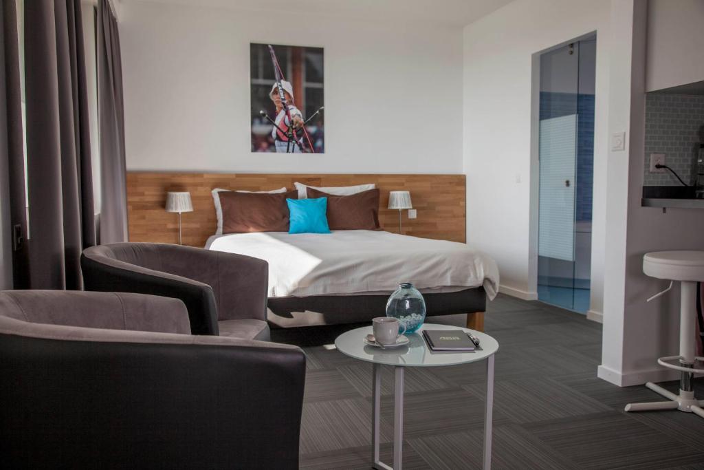Postel nebo postele na pokoji v ubytování Apart'Hotel 46a