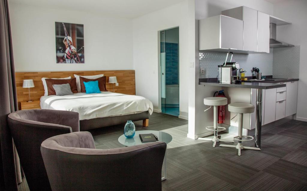 Kuchyň nebo kuchyňský kout v ubytování Apart'Hotel 46a