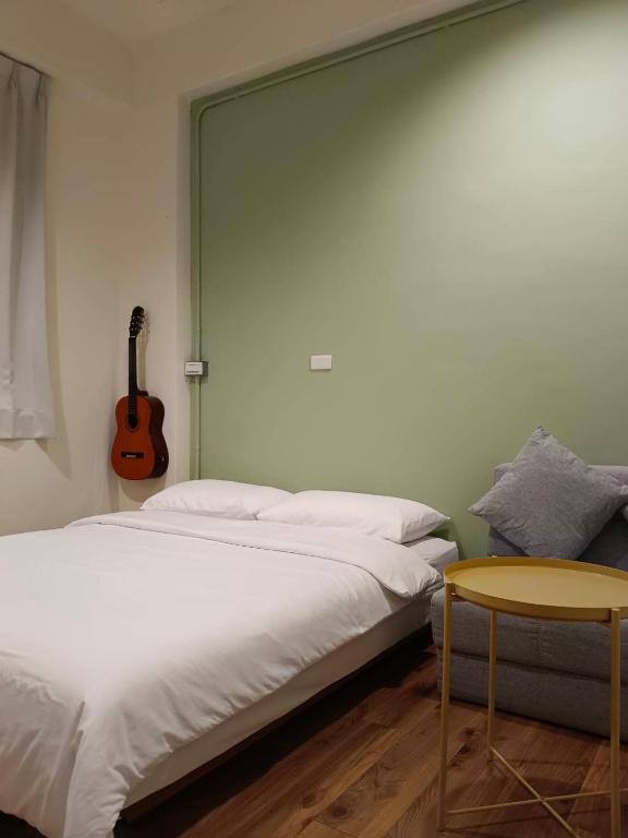Postel nebo postele na pokoji v ubytování 東海小時光 Tong Hai Time Homestay
