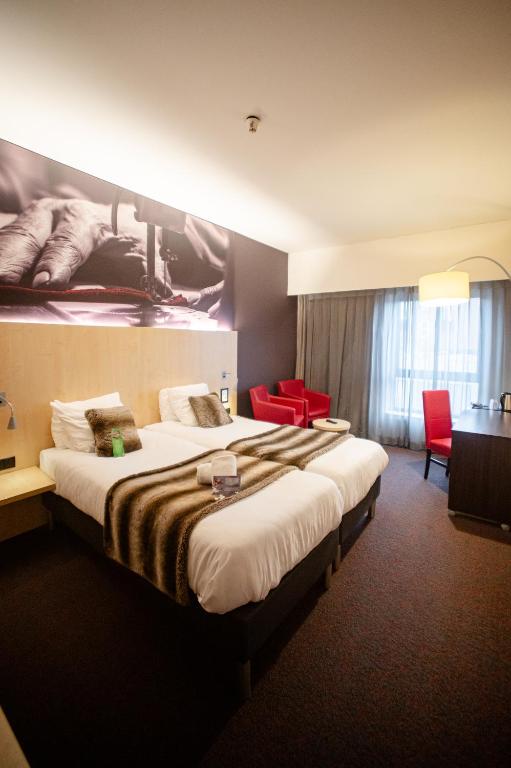 Postel nebo postele na pokoji v ubytování Hotel & Aparthotel Alize Mouscron
