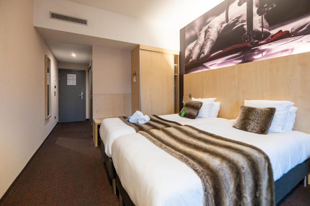 Postel nebo postele na pokoji v ubytování Hotel & Aparthotel Alize Mouscron
