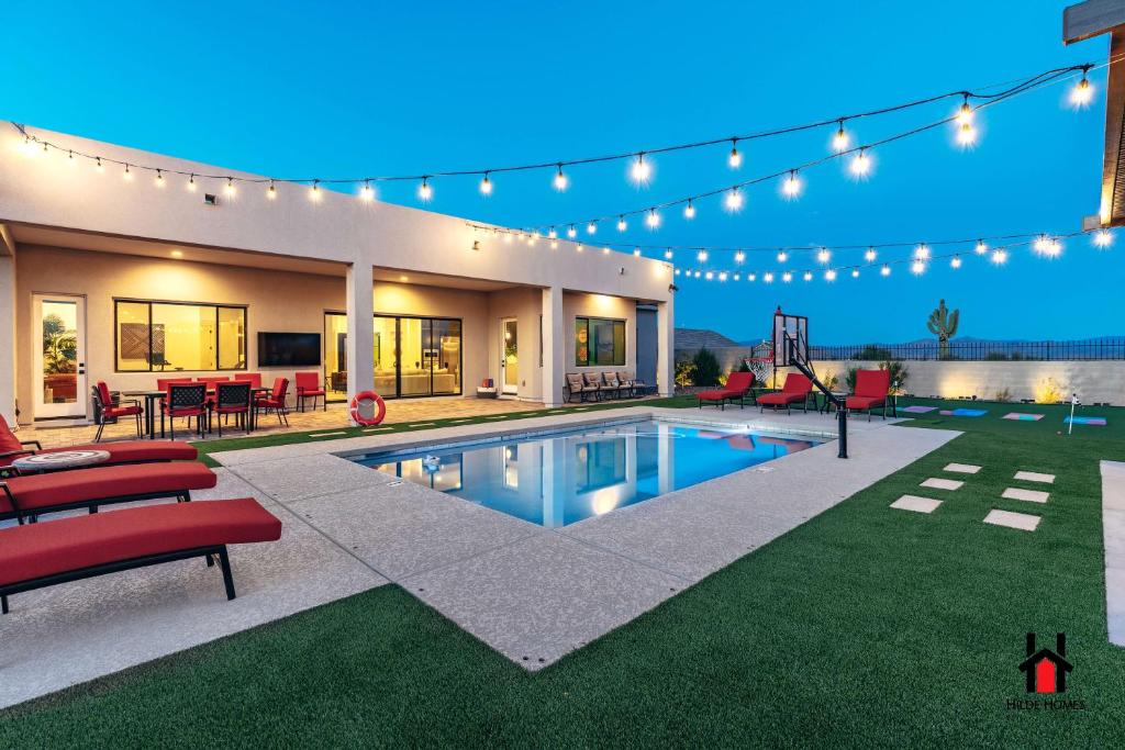 a house with a swimming pool in the yard at Peaceful Getaway to a New Custom-Built Luxury Home in Rio Verde