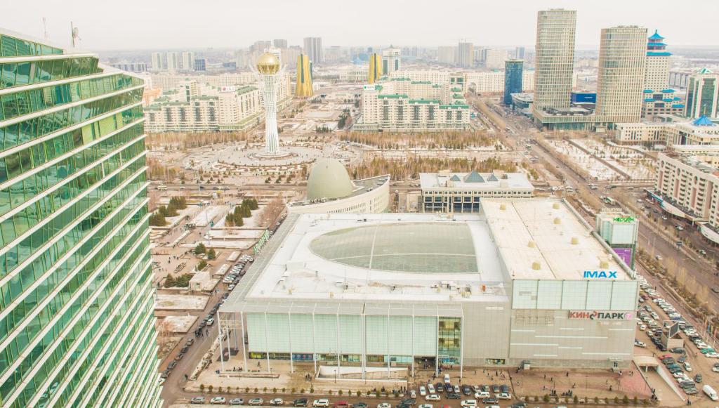 an aerial view of a city with a soccer stadium at SEVER 555 in Astana