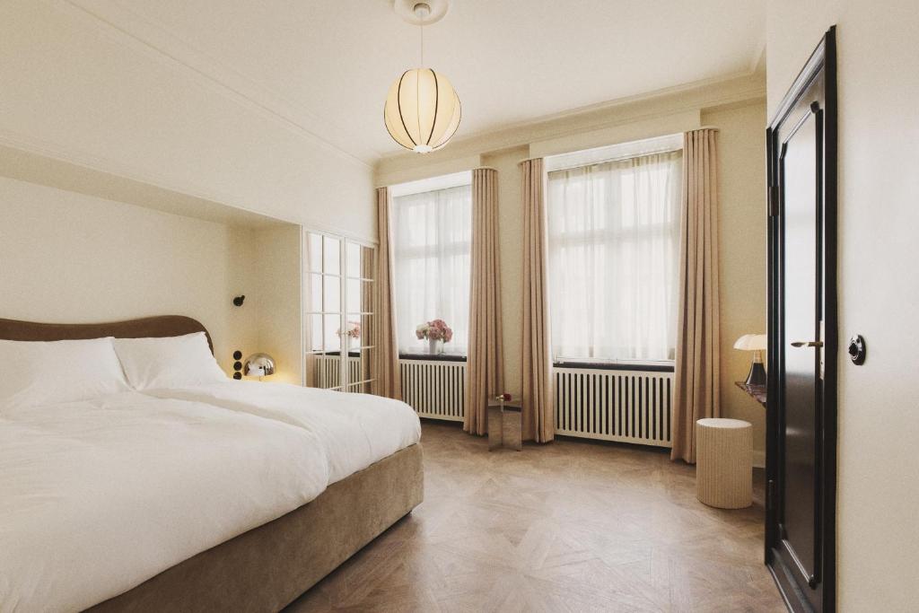 Postel nebo postele na pokoji v ubytování Hotel Bella Grande