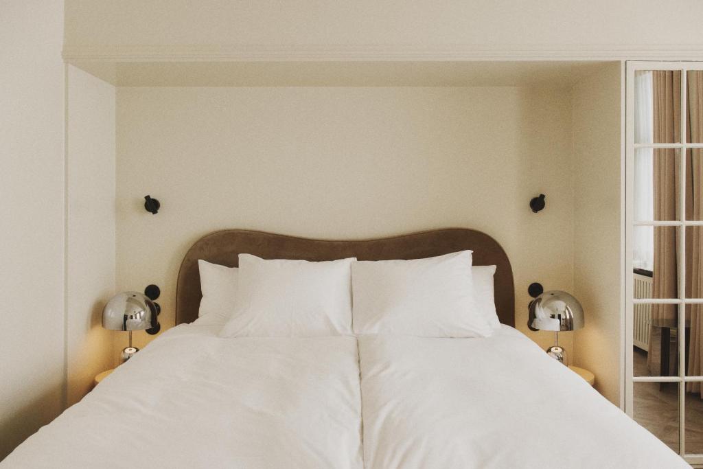 Postel nebo postele na pokoji v ubytování Hotel Bella Grande