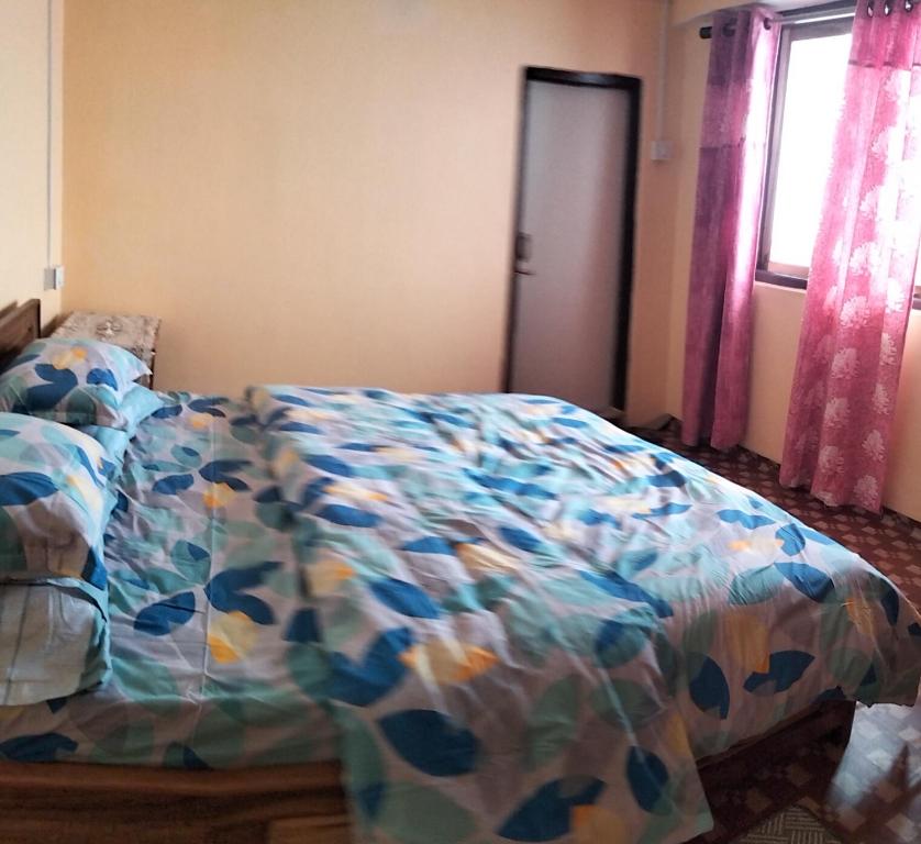 Postel nebo postele na pokoji v ubytování Sunrise Homestay