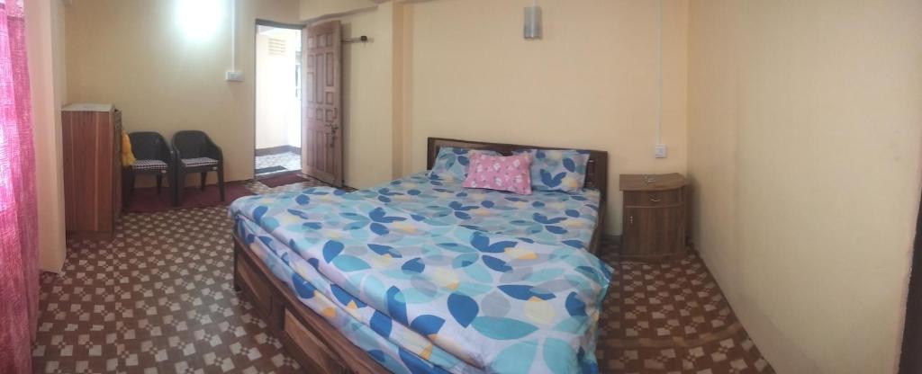 Postel nebo postele na pokoji v ubytování Sunrise Homestay