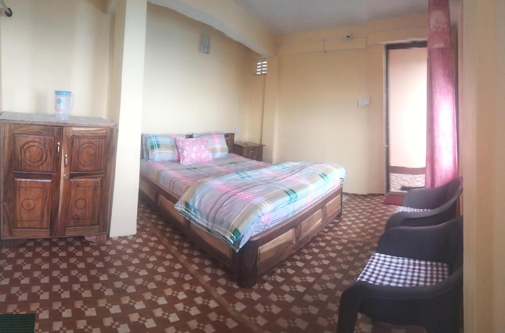 Postel nebo postele na pokoji v ubytování Sunrise Homestay