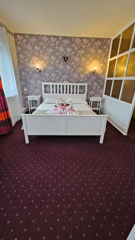 Postel nebo postele na pokoji v ubytování Hotel Olimp