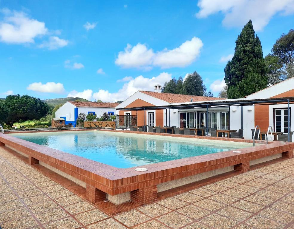 a swimming pool in front of a house at Naturarte Campo - Duna Parque Group in São Luis