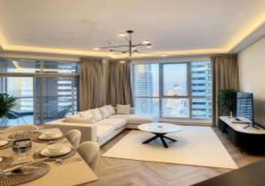 a living room with a couch and a table at Key View - Marina Torch in Dubai