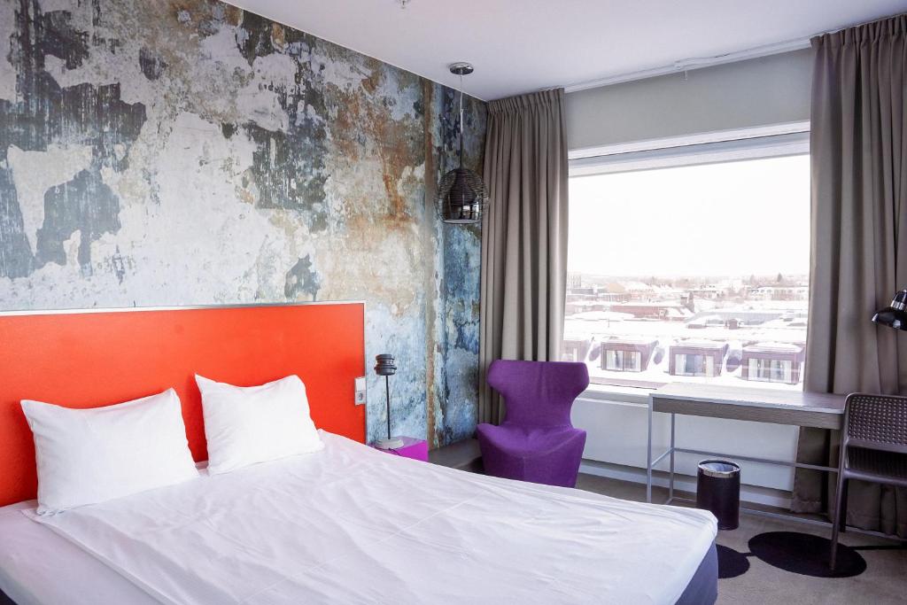 Postel nebo postele na pokoji v ubytování Comfort Hotel Winn