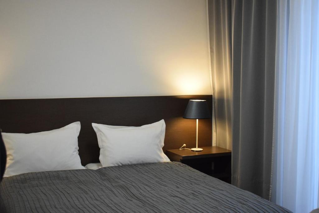 Postel nebo postele na pokoji v ubytování Hotel Divan
