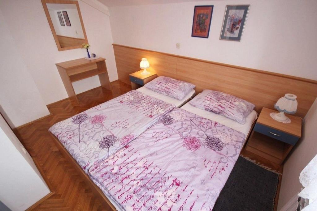 Posteľ alebo postele v izbe v ubytovaní Apartments Barisic