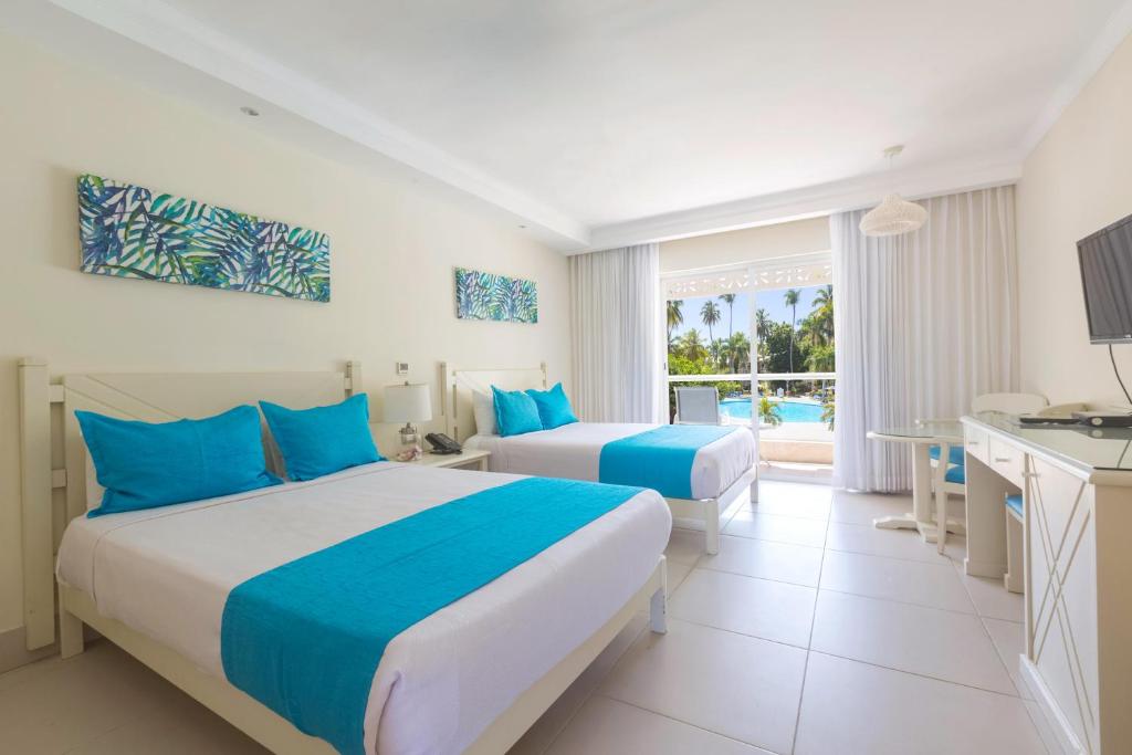 Postel nebo postele na pokoji v ubytování Vista Sol Punta Cana Beach Resort & Spa - All Inclusive