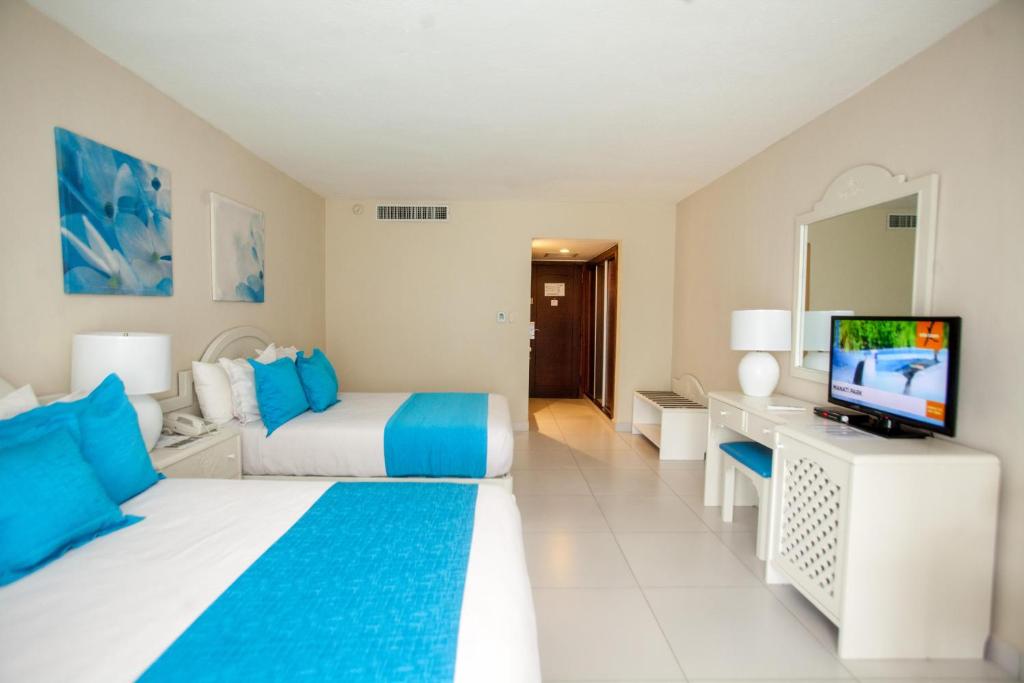 TV a/nebo společenská místnost v ubytování Vista Sol Punta Cana Beach Resort & Spa - All Inclusive