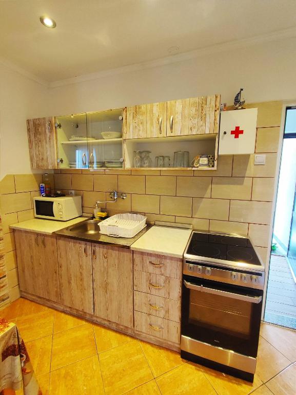 Kuchyň nebo kuchyňský kout v ubytování M&R apartmani Rovinj