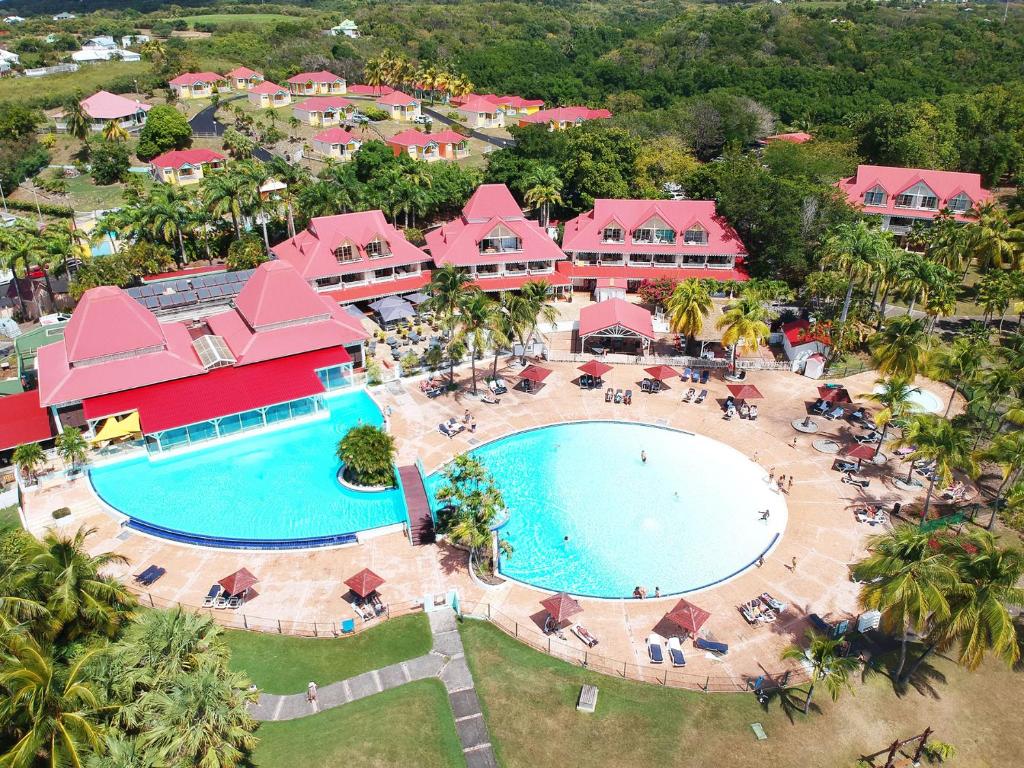an aerial view of the pool at the resort at Studio Coco Zen in Sainte-Anne