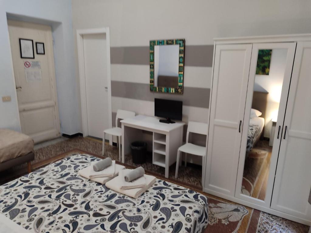 Postel nebo postele na pokoji v ubytování Albergo Locanda Alambra