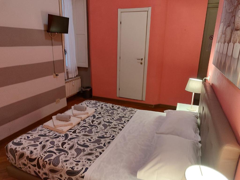 Postel nebo postele na pokoji v ubytování Albergo Locanda Alambra