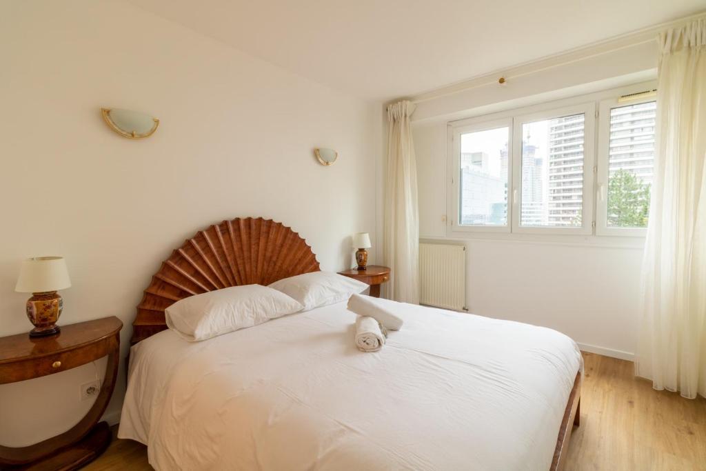 Postel nebo postele na pokoji v ubytování Appartement Boieldieu - Welkeys