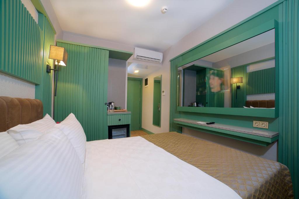 Postel nebo postele na pokoji v ubytování Çanakkale Bosphorus Port Aspen Hotel