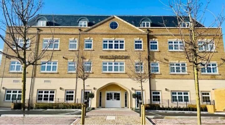 a large brick building with the front of it at The Hillbrook Hotel - Sherborne in Sherborne
