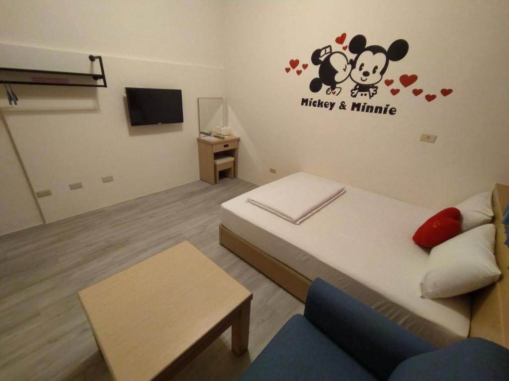 Postel nebo postele na pokoji v ubytování Penghu Le You You Homestay