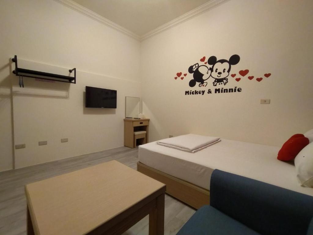 Postel nebo postele na pokoji v ubytování Penghu Le You You Homestay